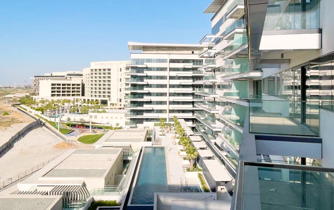 Mayan Yas Island Abu Dhabi waterfront residences showcasing contemporary architecture, landscaped gardens, and premium community living